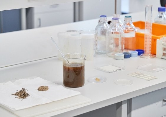 Banana pseudostem is dried, then powdered, then placed in alkaline solution to extract the cellulose, which is then processed into films of varying thicknesses.