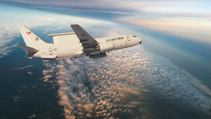 An artist's depiction shows an E-7A in flight.