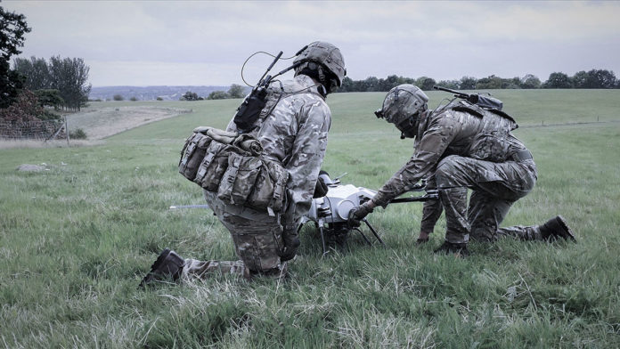 Elistair Orion UAV with Silvus ad hoc networking Soldiers