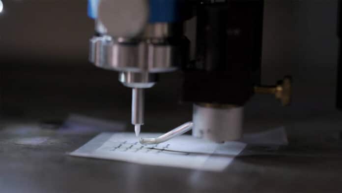 An aerosol jet printer puts down layers of carbon-based electronic inks to create transistors that can be fully recycled using only water, rather than requiring harsh, toxic chemicals.