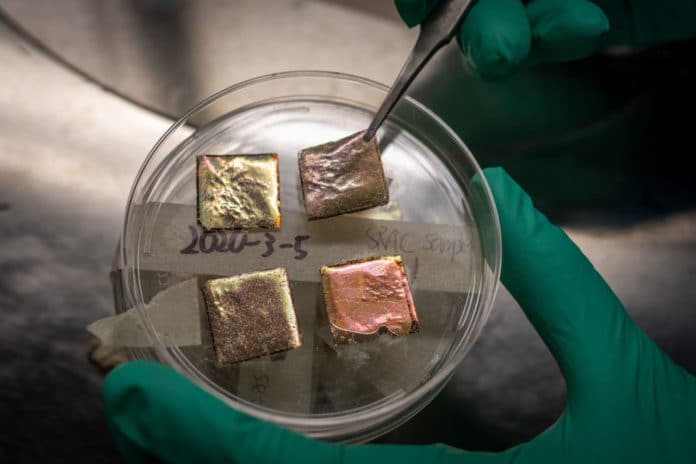 Samples of the temperature-adaptive radiative coating. The material looks like Scotch tape and can be affixed to a rooftop.