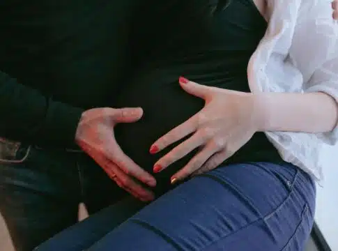 Crop couple waiting baby