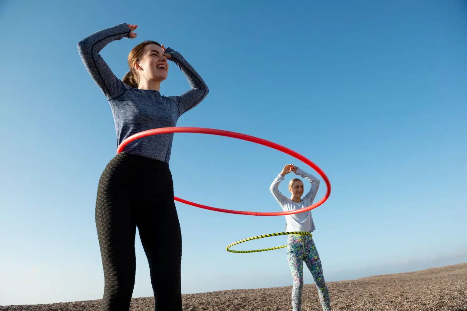 hulahoop Women exercising with hula hoop circle