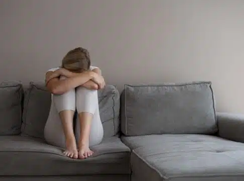 woman sitting on couch